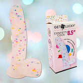 Image of the "Get Lucky Confetti Cock 8.5" Silicone Dildo, a confetti-themed novelty adult toy by Get Lucky, crafted from silicone with a playful design. The packaging highlights its vibrant style while colorful bokeh lights enhance the display, making this suction cup dildo a standout choice for fun enthusiasts.